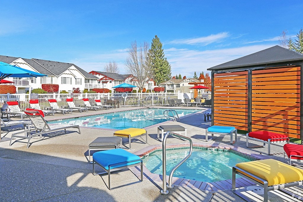 pool and spa with lounge chairs at Clock Tower Village, DuPont Washington