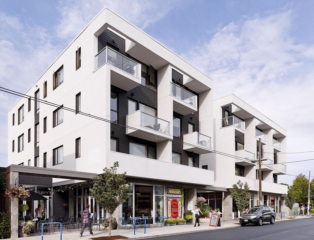 an artist impression of an apartment building on a city street
