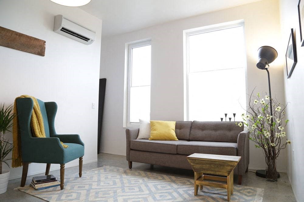 a living room with a couch and a chair