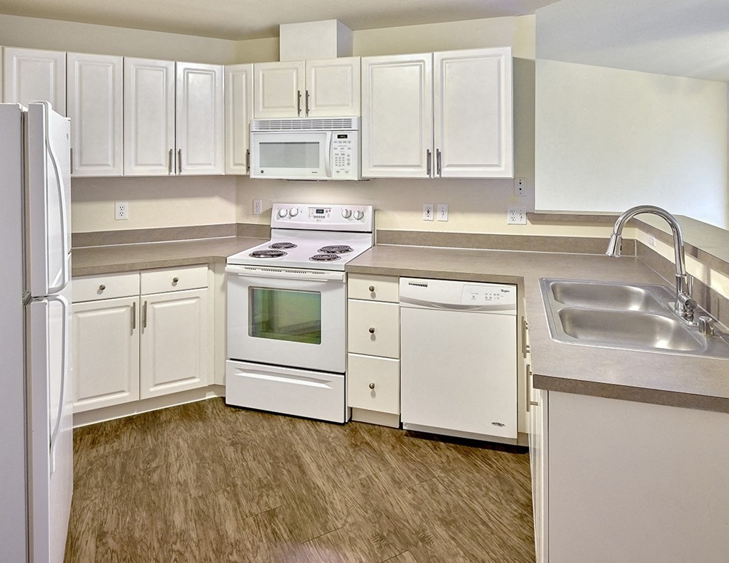kitchen with white appliances at Clock Tower Village, Washington, 98327