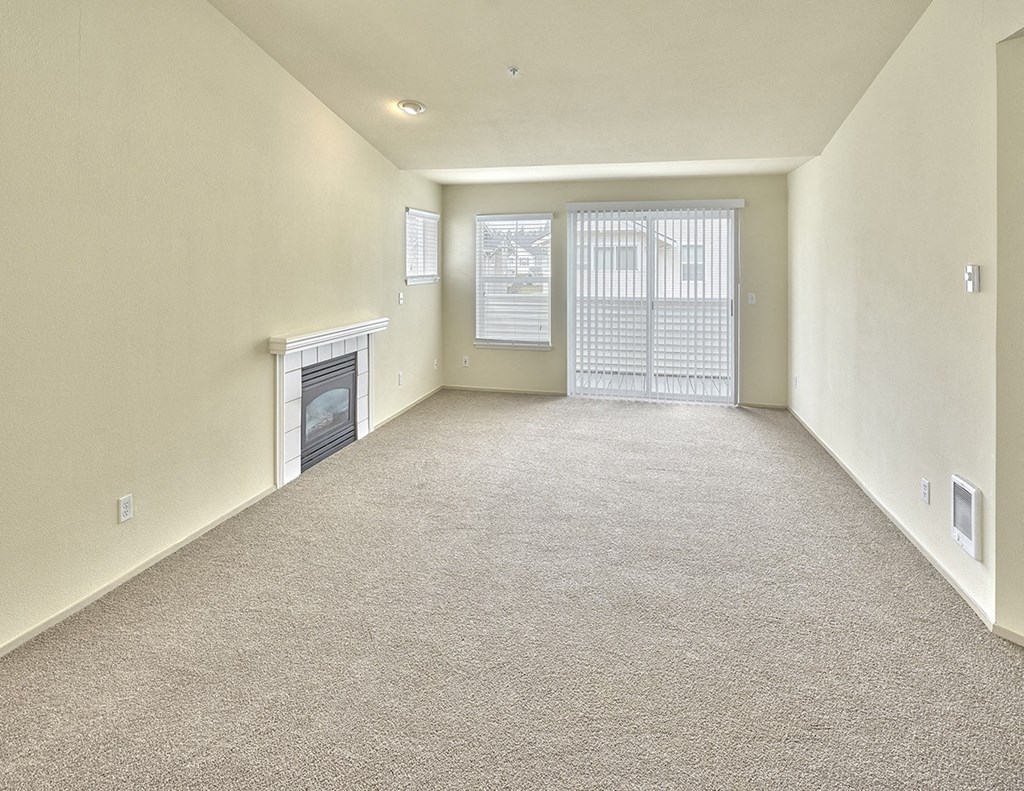 living area with fireplace and attached balcony at Clock Tower Village, DuPont, WA 98327
