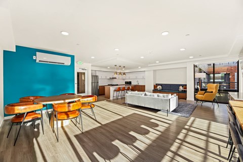 A room with a blue wall and a white couch.