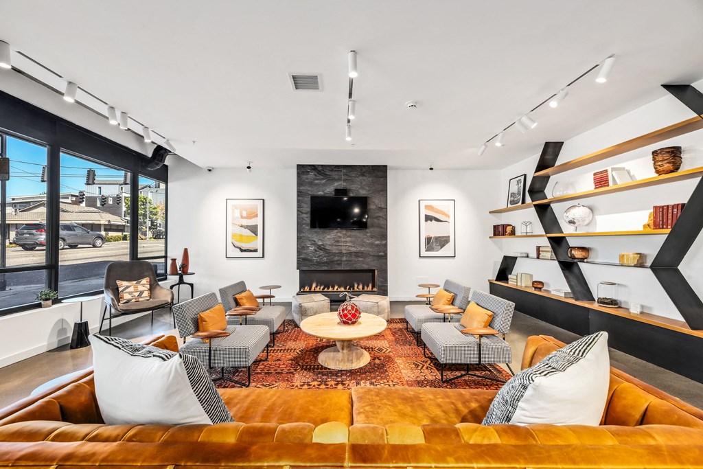 a living room with couches and chairs and a fireplace