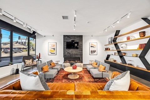 a living room with couches and chairs and a fireplace