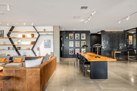 the interior of a restaurant with a long wooden table and chairs