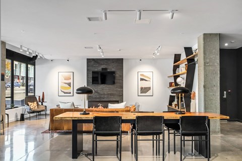 a dining room with a table and chairs and a living room