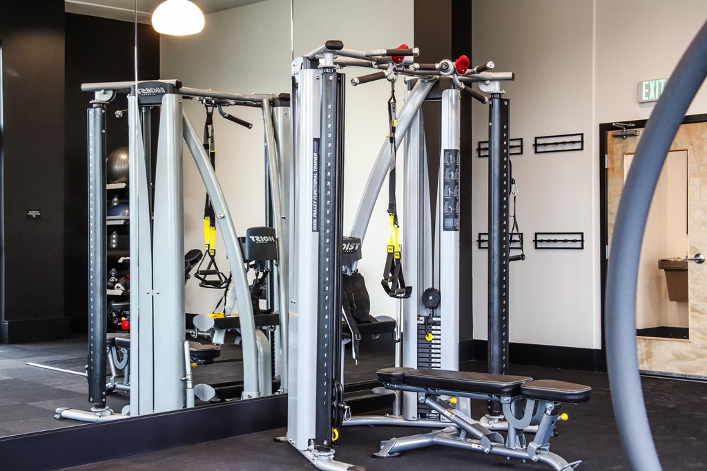 a gym with weights machines and other equipment