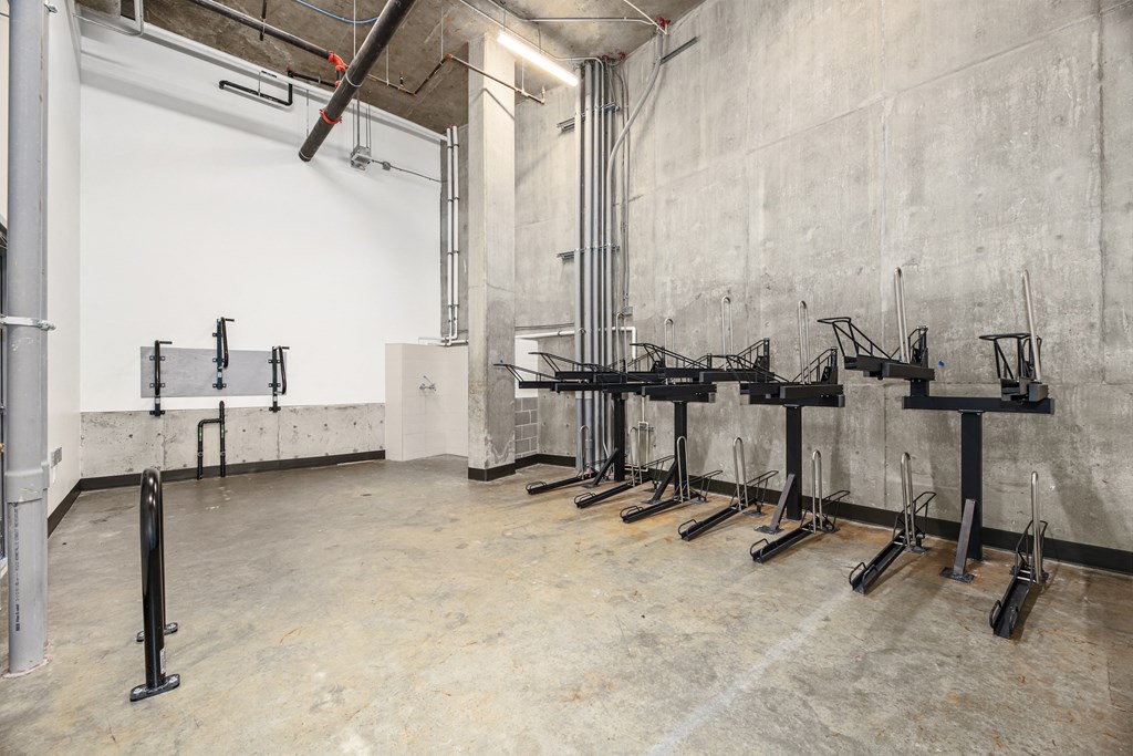 a row of metal drying racks in a room