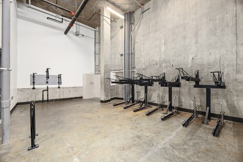 a row of metal drying racks in a room