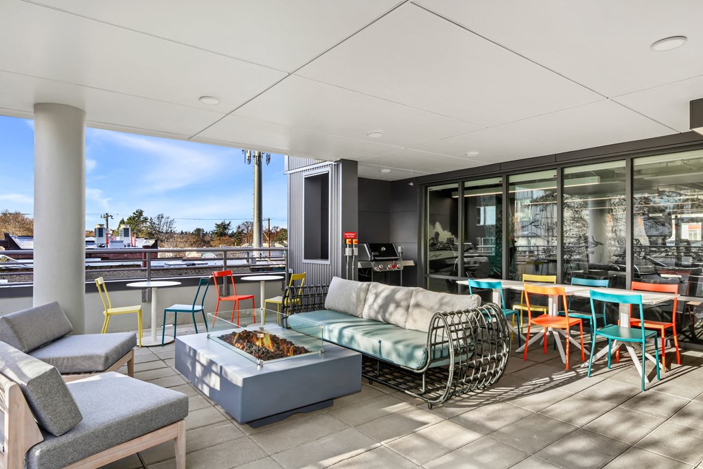 A patio with a table and chairs.
