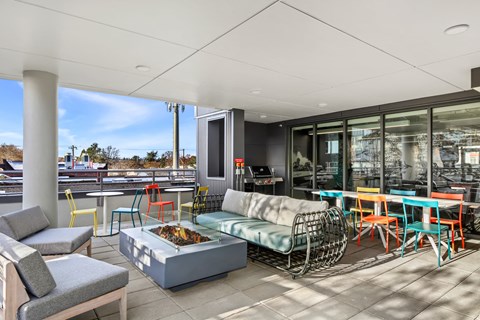 A patio with a table and chairs.