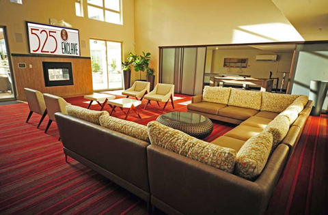 A living room with a couch and chairs.