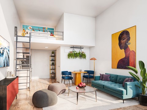 A living room with a blue couch, a red cabinet, and a painting on the wall.