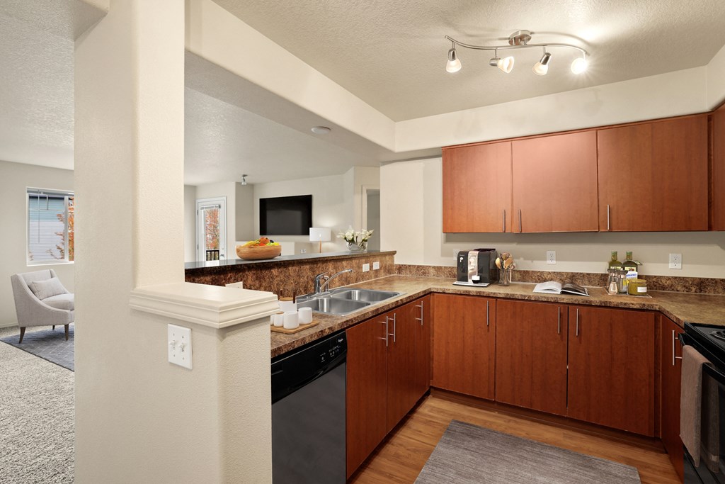 a spacious kitchen with wood cabinets and granite counter tops