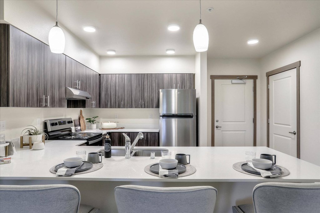 a kitchen with a counter top and a sink