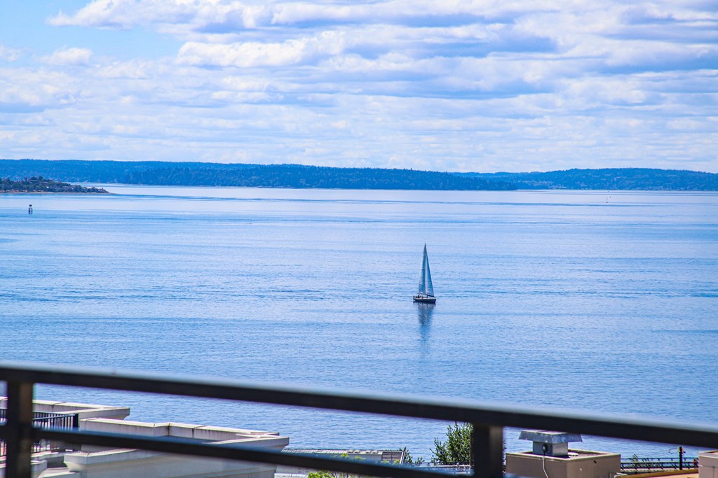 a sailboat in the middle of the water on a lake