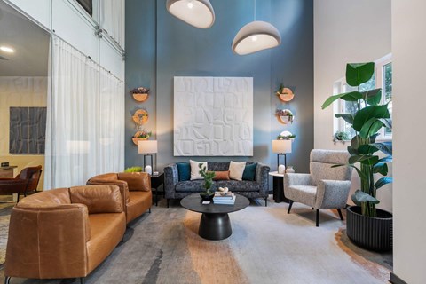 A living room with a large couch and a coffee table.