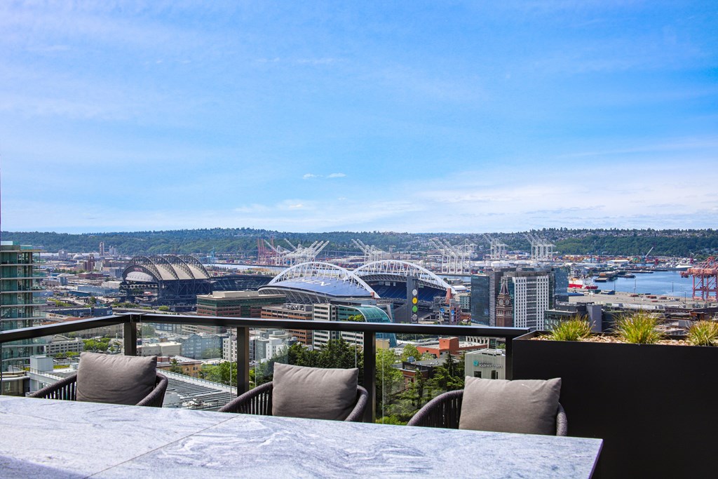 A cityscape with a bridge and buildings in the distance.