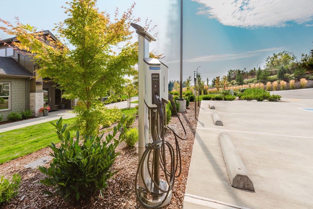 A charging station for electric vehicles is located in a parking lot.