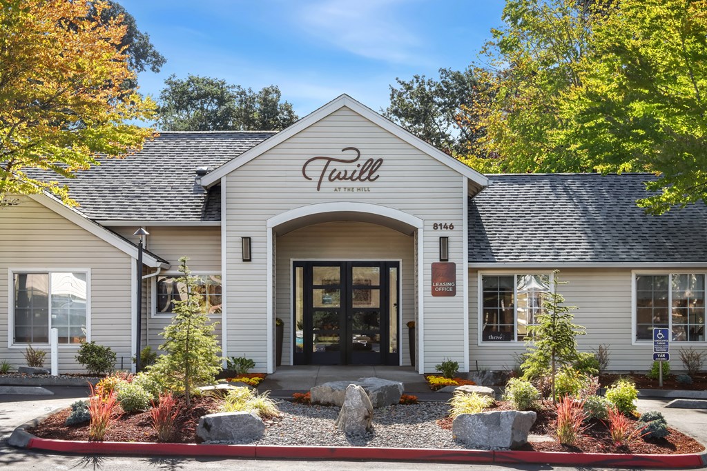 A white building with the name "Twill" on the front.