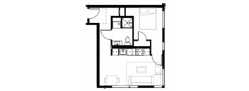 a small room with a bed and a desk