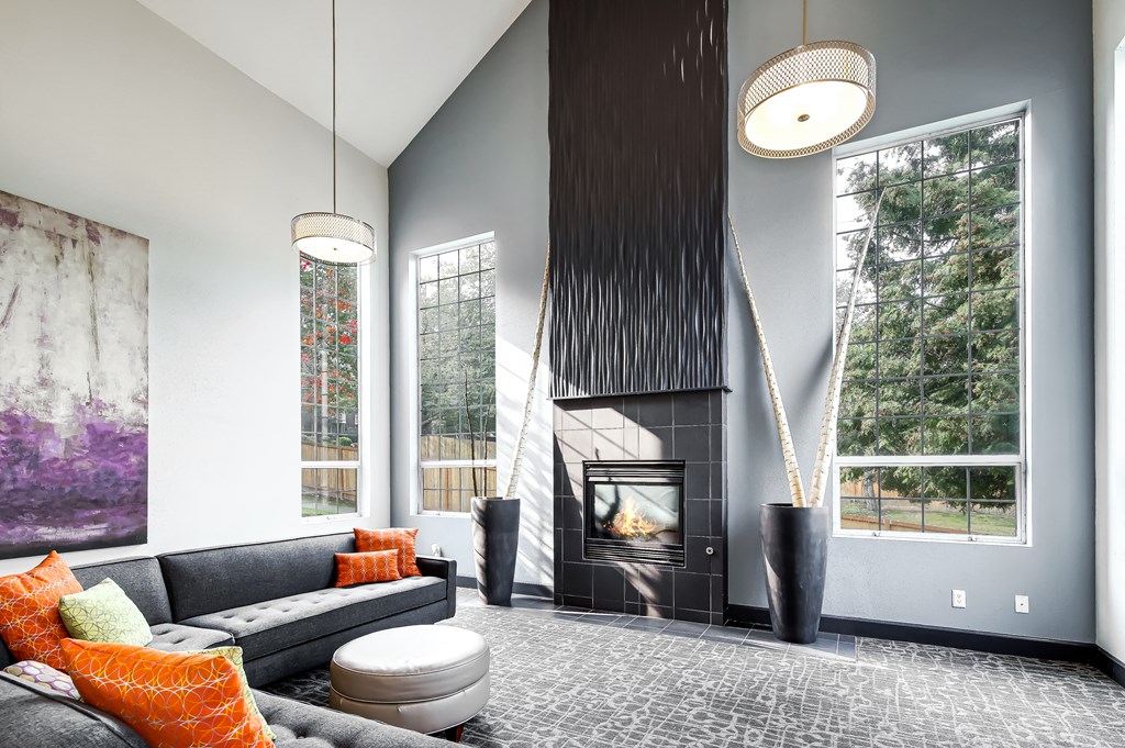 a living room with couches and a fireplace