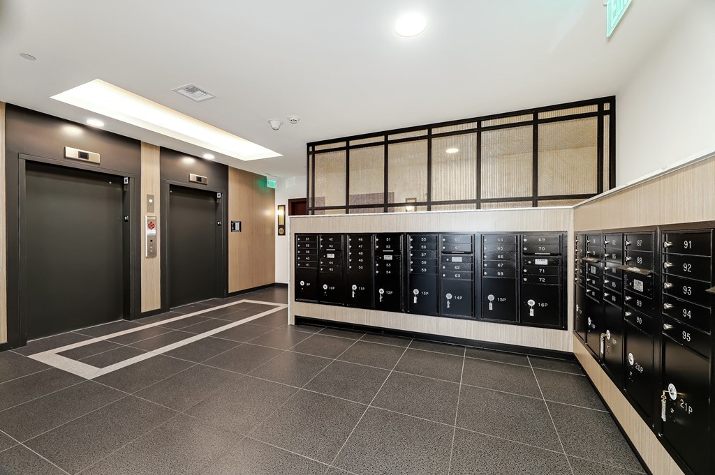 the lockers in the lobby of a building with doors