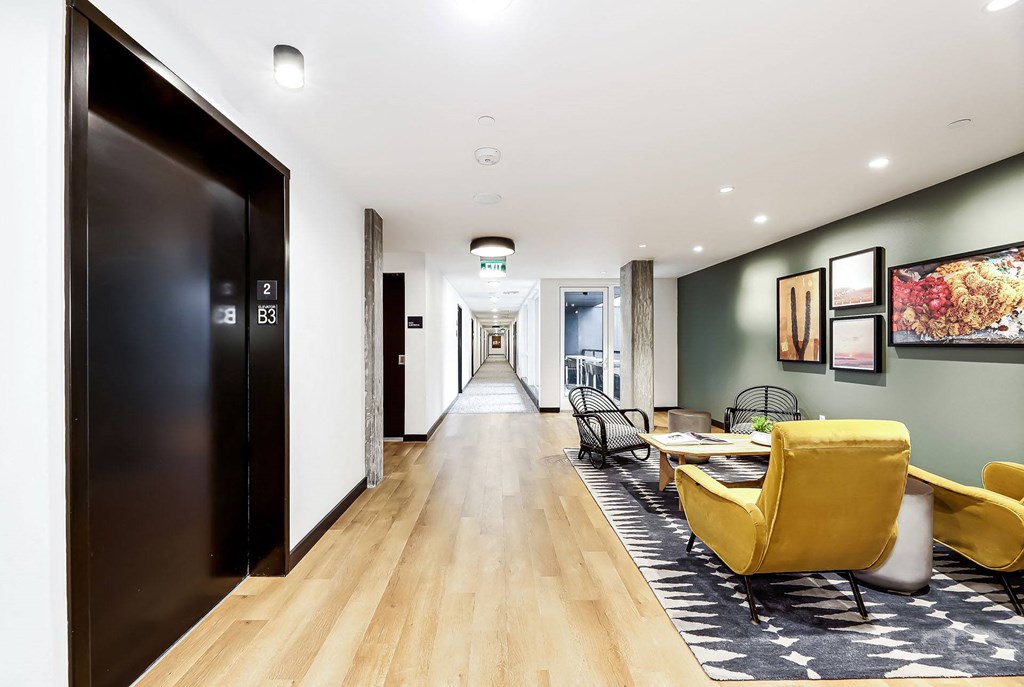a living room with a couch and a table and a door