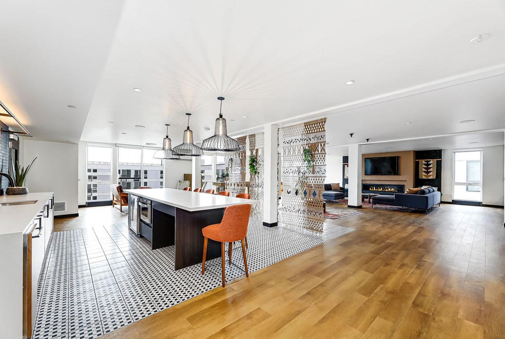 a large living room with a kitchen and a dining room