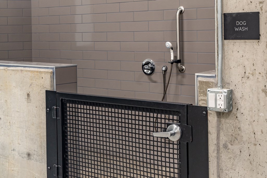 a bathroom with a shower and a door with a door knob