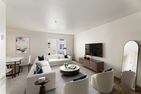 a living room with couches and chairs and a table