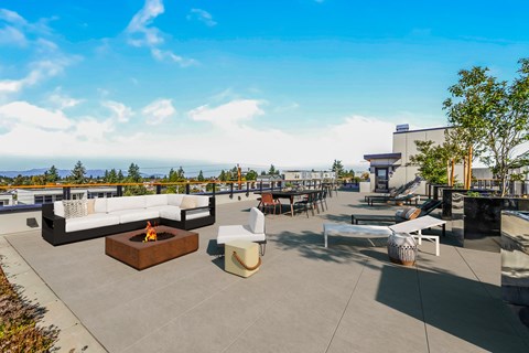 a rendering of a rooftop patio with couches and tables