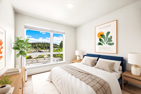 a bedroom with a bed and a large window
