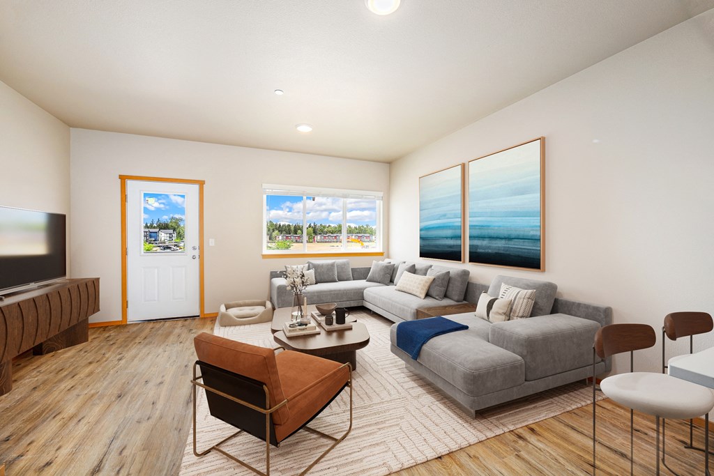 a living room with a gray couch and a coffee table