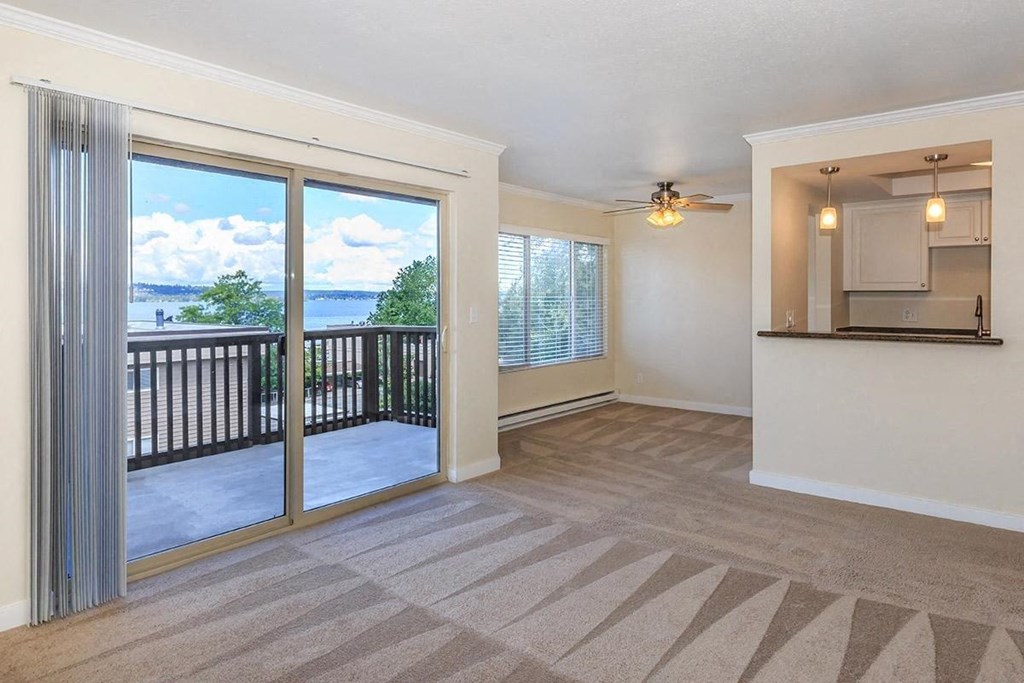 a living room with sliding glass doors to a balcony