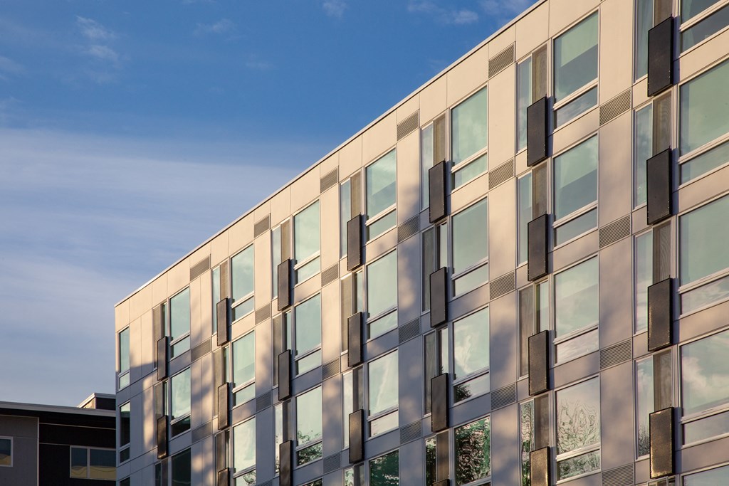 the facade of a building with a blue sky in the background