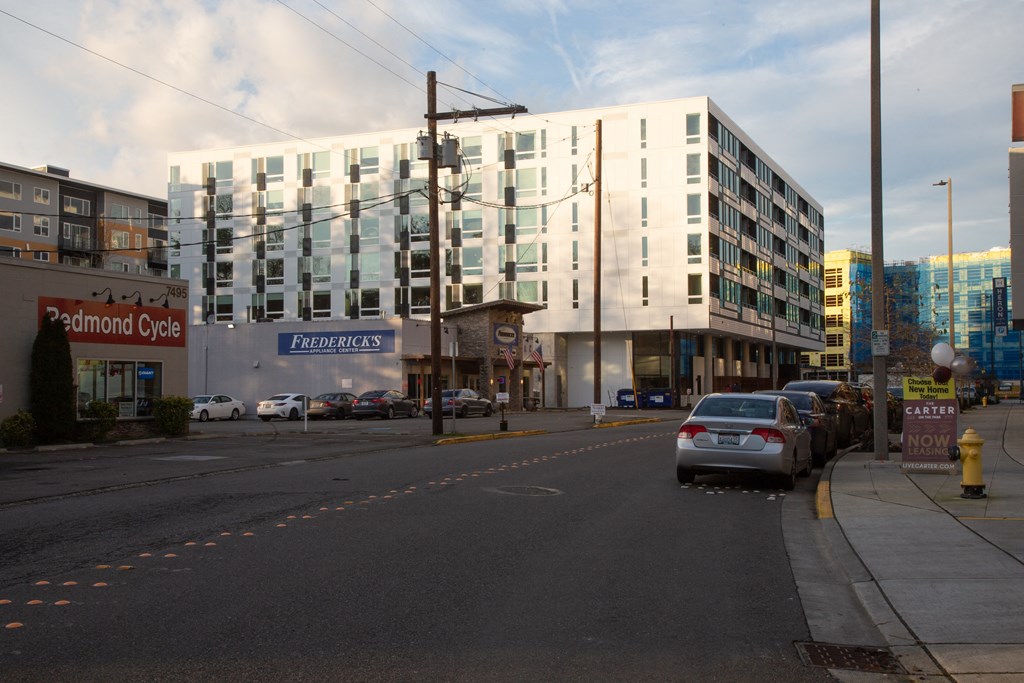 a large white building on the side of a city street