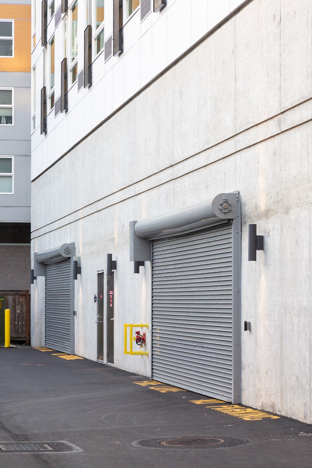 a pair of garage doors on the side of a building