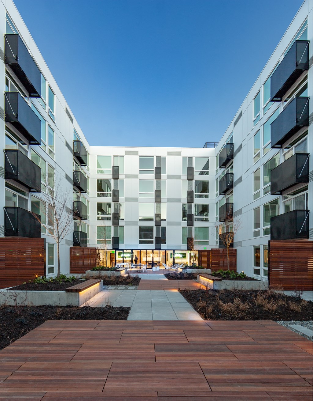 an open courtyard in front of an apartment building