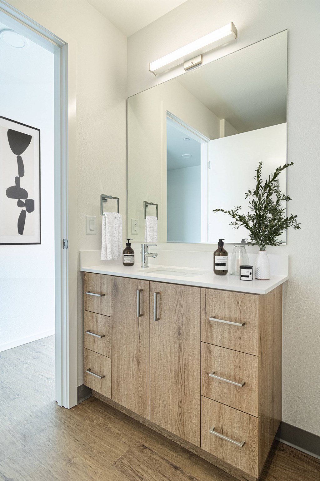 a modern and funky half bathroom reveal with black and white tile in a modern laundry space