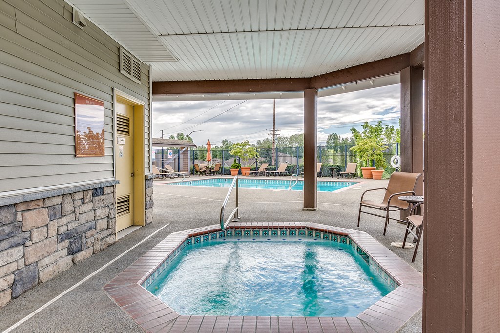 our resort style swimming pool is right next to our covered patio with a patio door