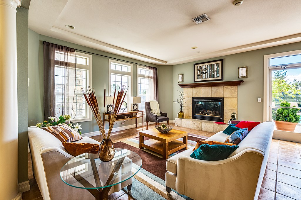 a living room with a couch and a fireplace