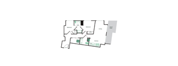 A floor plan of a house with two bedrooms, a living area, a kitchen, a bath, a deck/patio, and an entry.