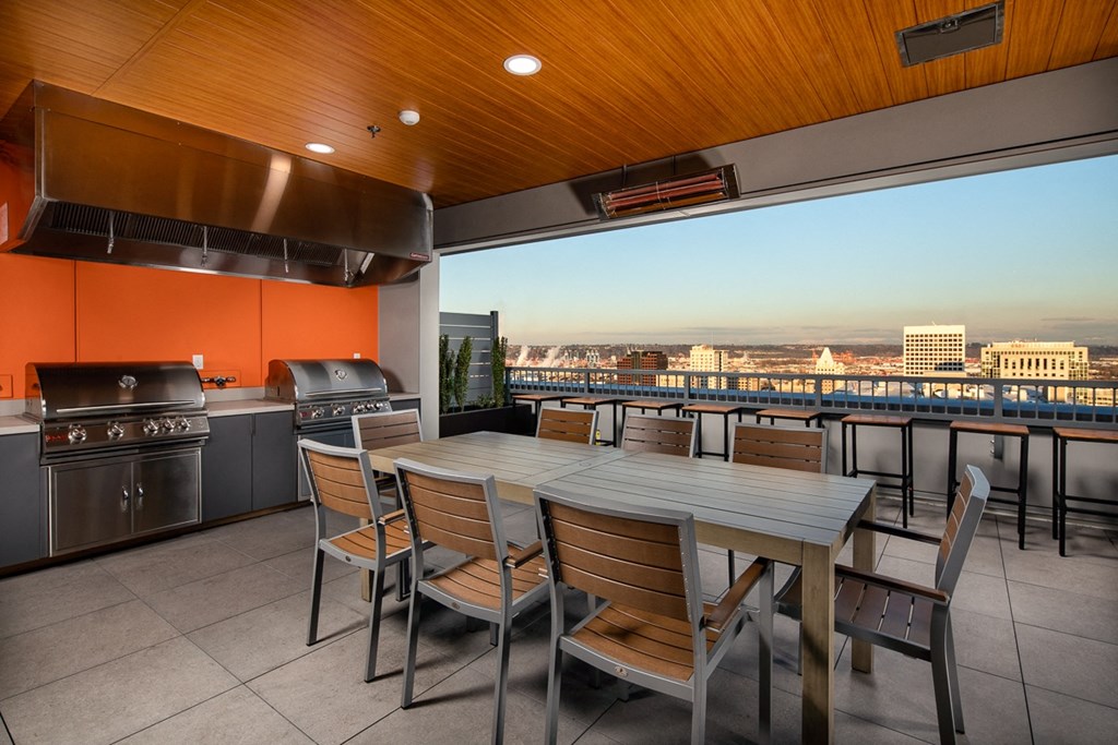 a dining area with a table and chairs and a balcony