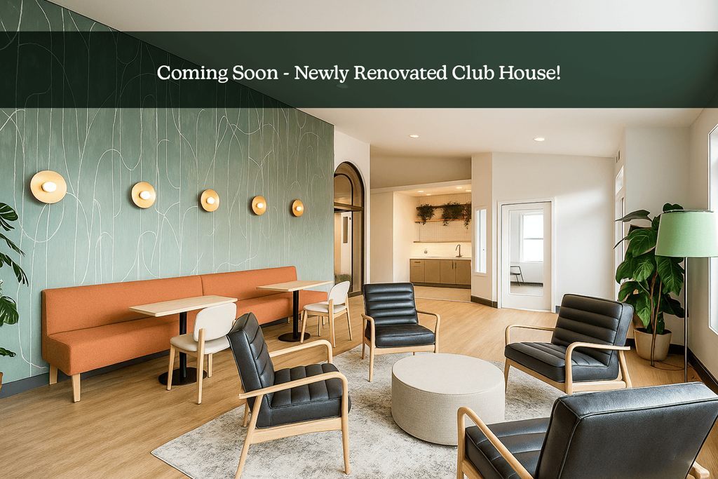A newly renovated club house with a green wall and black leather chairs.