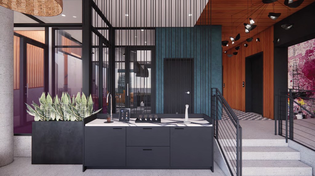 the kitchen is at the bottom of the stairs in the middle of the house