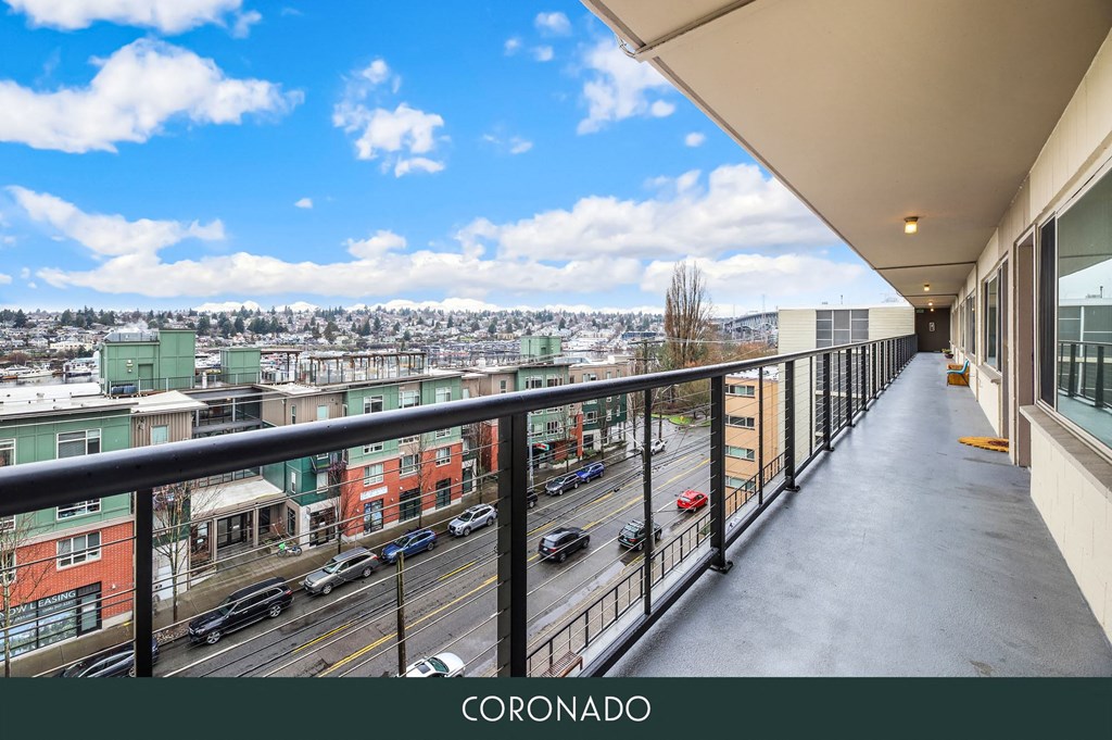 a view of a city from a balcony of a building