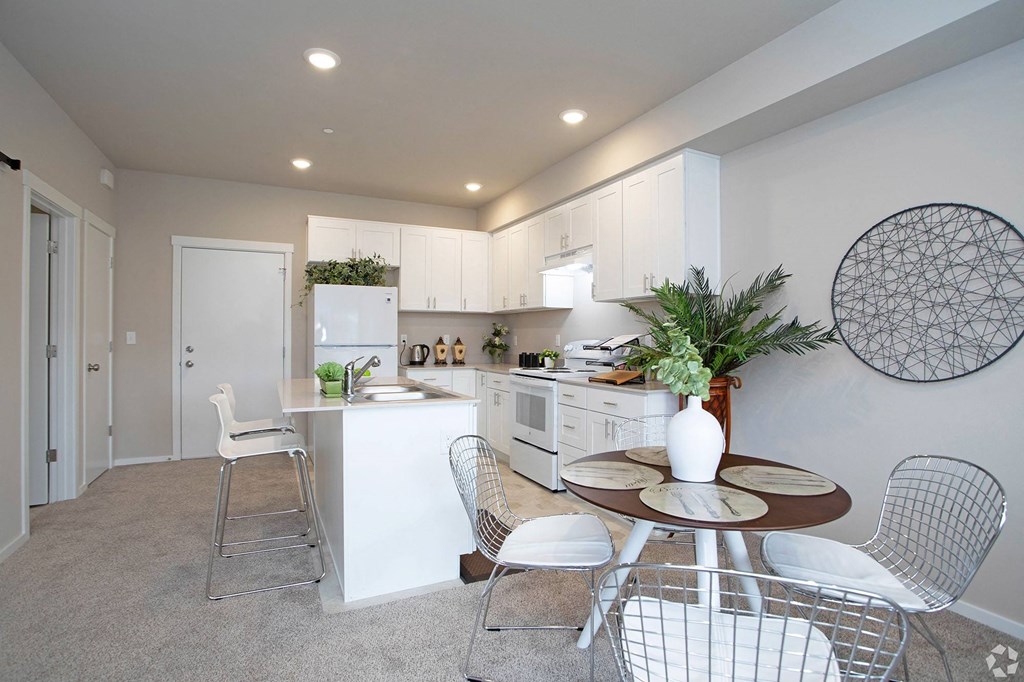 a kitchen and dining area in a 555 waverly unit