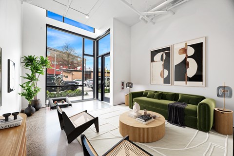 A living room with a green couch and a coffee table.