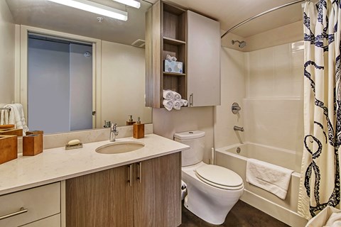 A bathroom with a white toilet and a white sink.